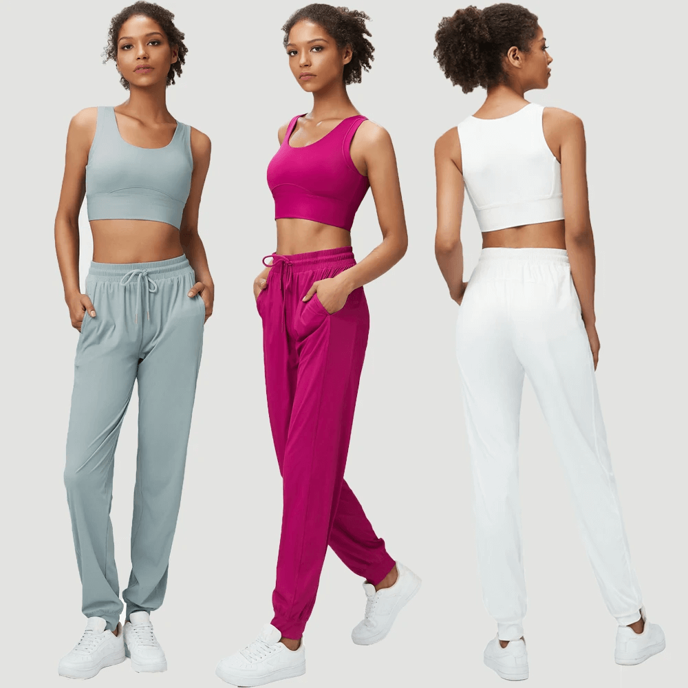 Women's stylish joggers and sports bra set in blue, pink, and white - perfect for active and casual wear.